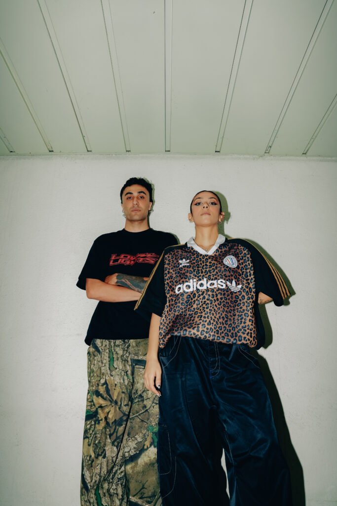A standing portrait of Emad and Elika looking into camera.